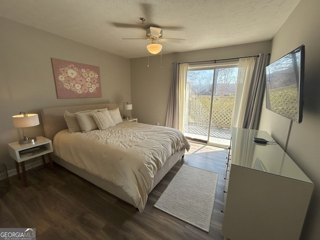 bedroom with dark wood-type flooring, access to exterior, a textured ceiling, baseboards, and ceiling fan