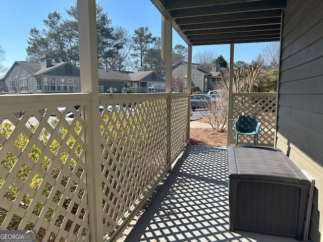 balcony with ac unit and a residential view