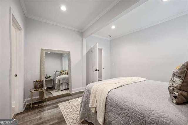 bedroom featuring recessed lighting, wood finished floors, baseboards, and ornamental molding