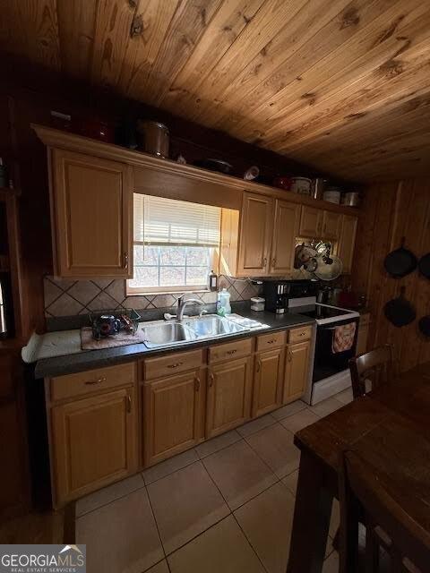 kitchen featuring light tile patterned floors, a sink, decorative backsplash, range with electric stovetop, and wooden ceiling