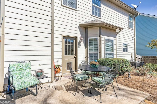 view of patio / terrace featuring outdoor dining space and fence