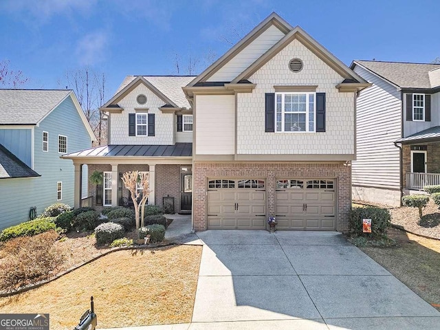 craftsman house with a garage, a standing seam roof, brick siding, and concrete driveway