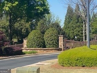 view of gate featuring fence