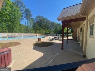 view of patio featuring a community pool