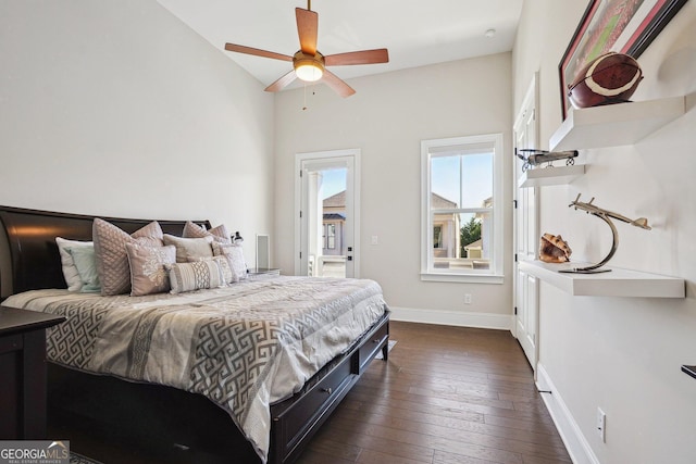 bedroom featuring a ceiling fan, baseboards, and dark wood-style flooring