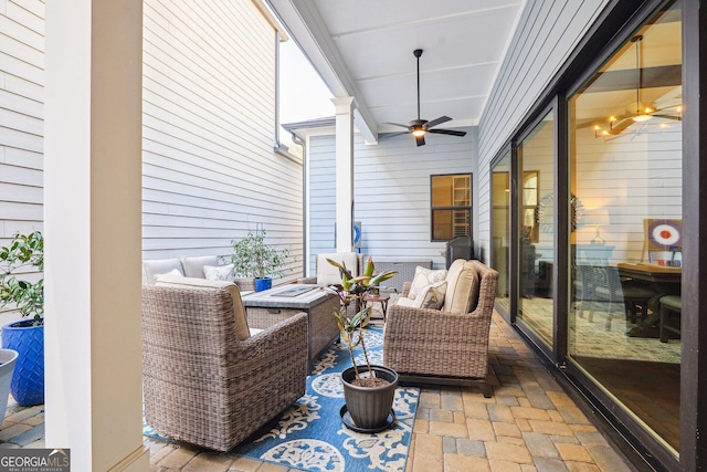 sunroom with a ceiling fan