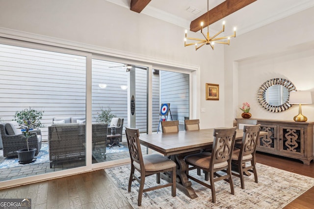 dining space featuring visible vents, crown molding, dark wood finished floors, beam ceiling, and a notable chandelier