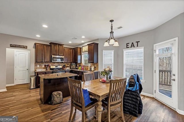 dining space with recessed lighting, visible vents, baseboards, and dark wood-style floors