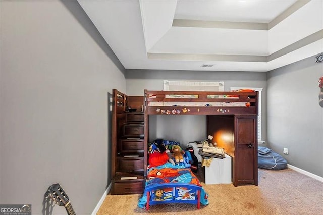 bedroom with baseboards, carpet floors, and visible vents