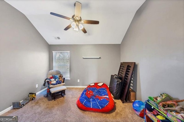 playroom with carpet, visible vents, baseboards, ceiling fan, and vaulted ceiling