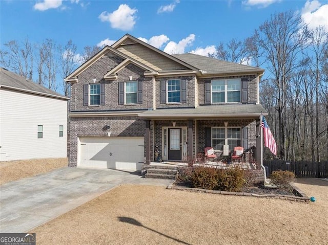 craftsman inspired home featuring fence, driveway, a porch, a garage, and brick siding