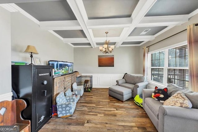 interior space featuring beamed ceiling, wainscoting, wood finished floors, a notable chandelier, and coffered ceiling