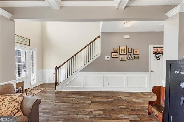 interior space with beam ceiling, stairway, crown molding, and dark wood-type flooring