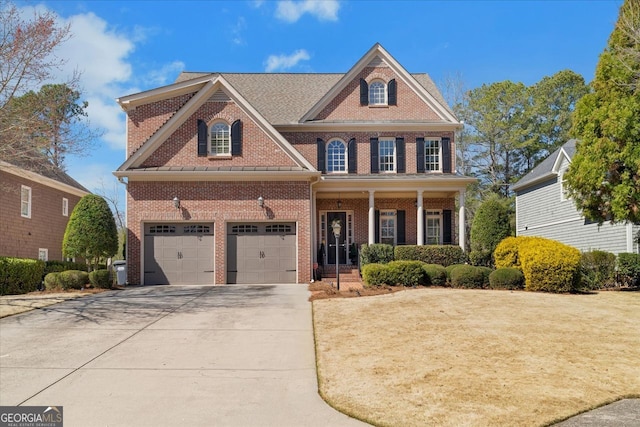 view of front of property with brick siding, a porch, and concrete driveway