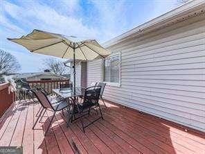 deck featuring outdoor dining area