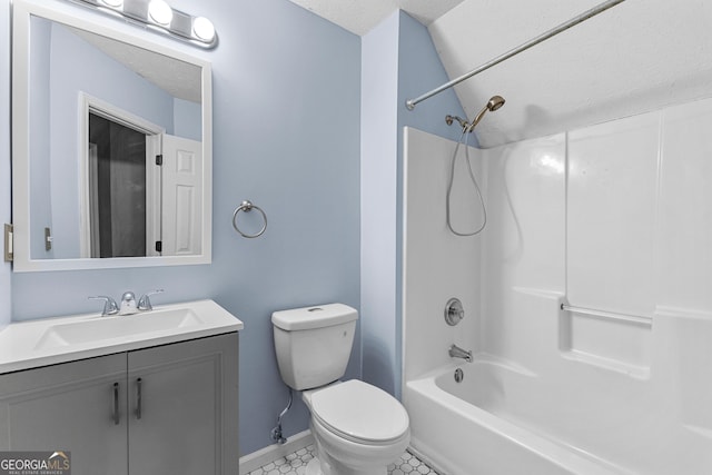 bathroom with toilet, a textured ceiling, shower / bathing tub combination, baseboards, and vanity