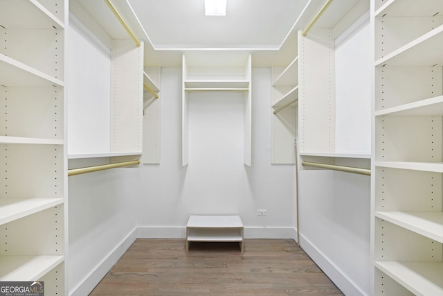 spacious closet with wood finished floors