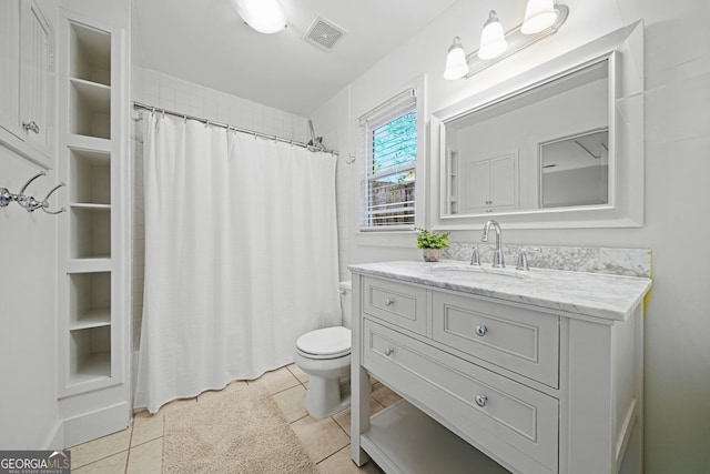 full bathroom featuring visible vents, toilet, a shower with shower curtain, tile patterned flooring, and vanity