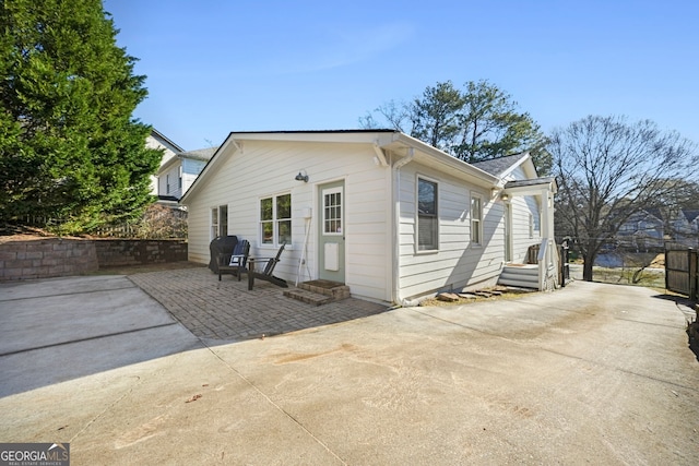 view of side of property featuring a patio