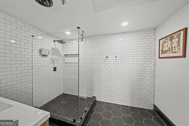 bathroom with tile patterned flooring, recessed lighting, and a stall shower