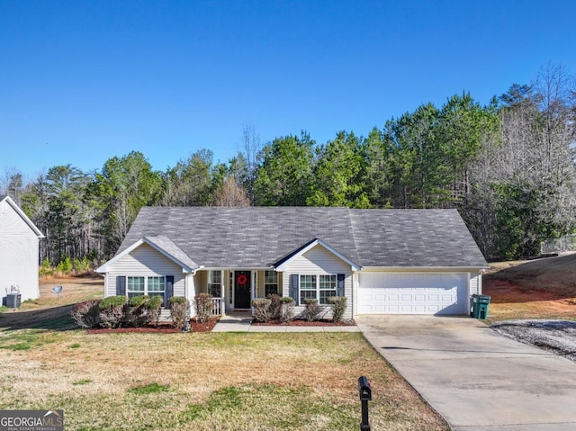 ranch-style home with a front lawn, a garage, and driveway