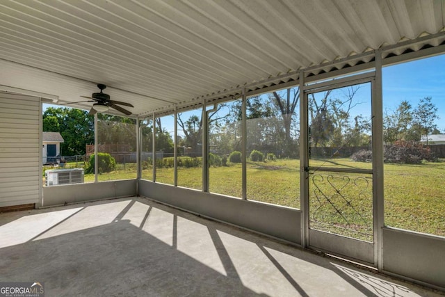 unfurnished sunroom with ceiling fan