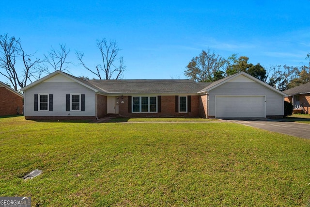 ranch-style house featuring brick siding, a garage, a front lawn, and driveway