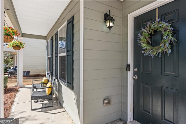 property entrance featuring covered porch