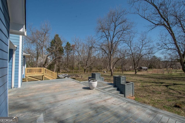 wooden deck with a yard