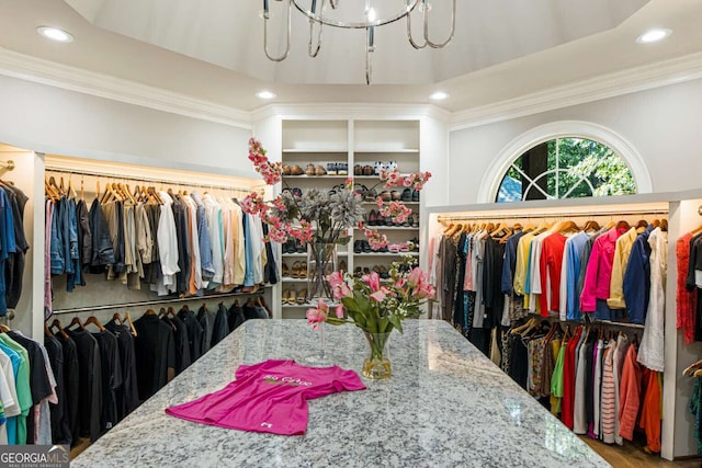 912 Mcelroy Mountain Dr, Big Canoe, GA 30143 - walk in closet with a chandelier and wood finished floors