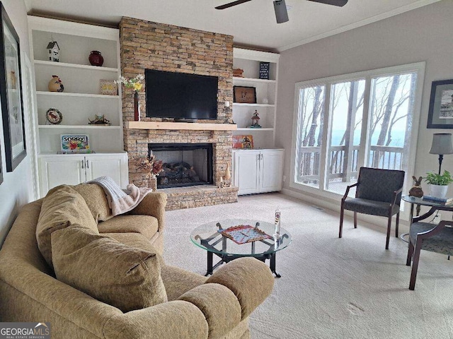912 Mcelroy Mountain Dr, Big Canoe, GA 30143 - living room featuring carpet flooring, ceiling fan, a stone fireplace, ornamental molding, and built in features