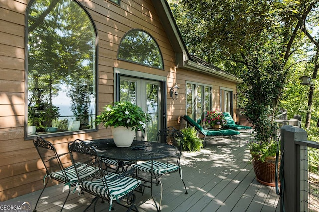 912 Mcelroy Mountain Dr, Big Canoe, GA 30143 - wooden terrace featuring french doors and outdoor dining space