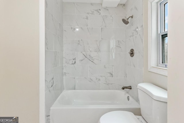 bathroom featuring toilet and shower / bath combination