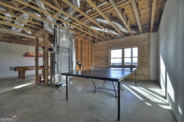 recreation room with concrete flooring