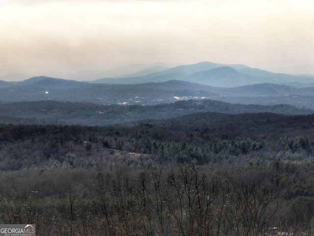 view of mountain feature with a view of trees