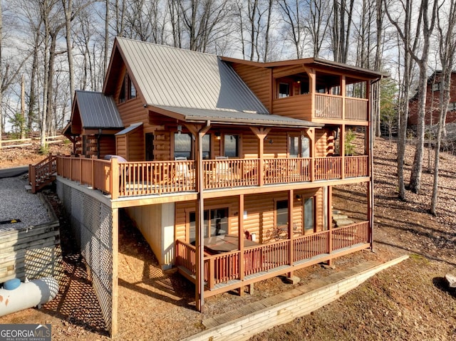 rear view of house with metal roof