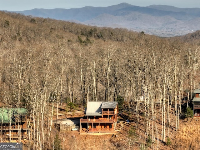 property view of mountains with a wooded view