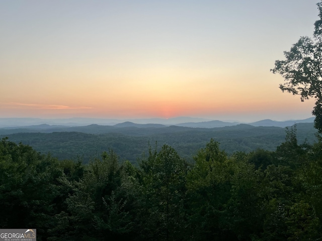 view of mountain feature with a view of trees