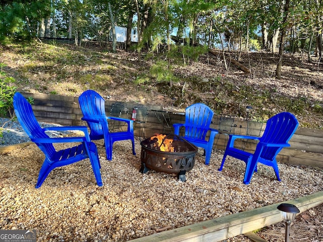 view of jungle gym featuring an outdoor fire pit