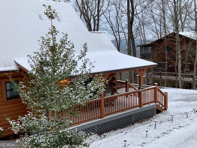 view of snow covered deck