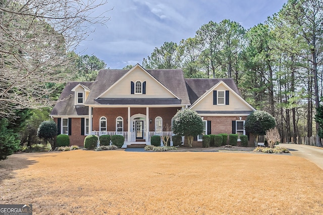 1621 Annapolis Way, Grayson, GA 30017 - neoclassical home featuring a porch, brick siding, and a front yard