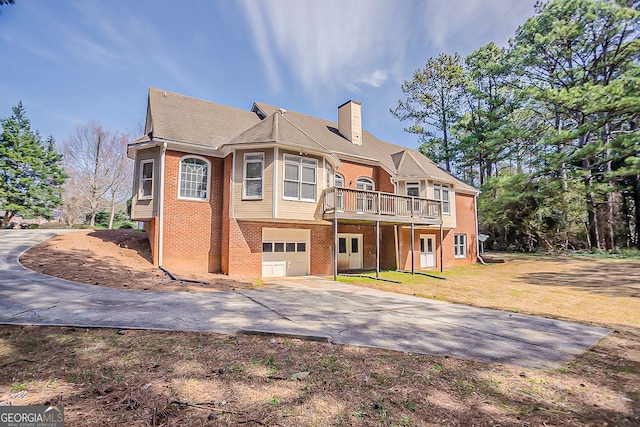 1621 Annapolis Way, Grayson, GA 30017 - view of front facade featuring brick siding, a front lawn, concrete driveway, a chimney, and a garage