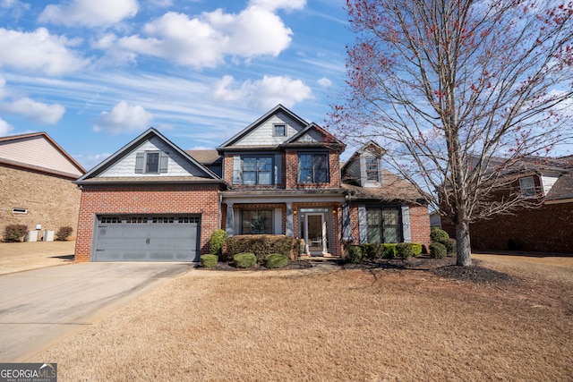 view of front of house featuring brick siding, concrete driveway, and an attached garage