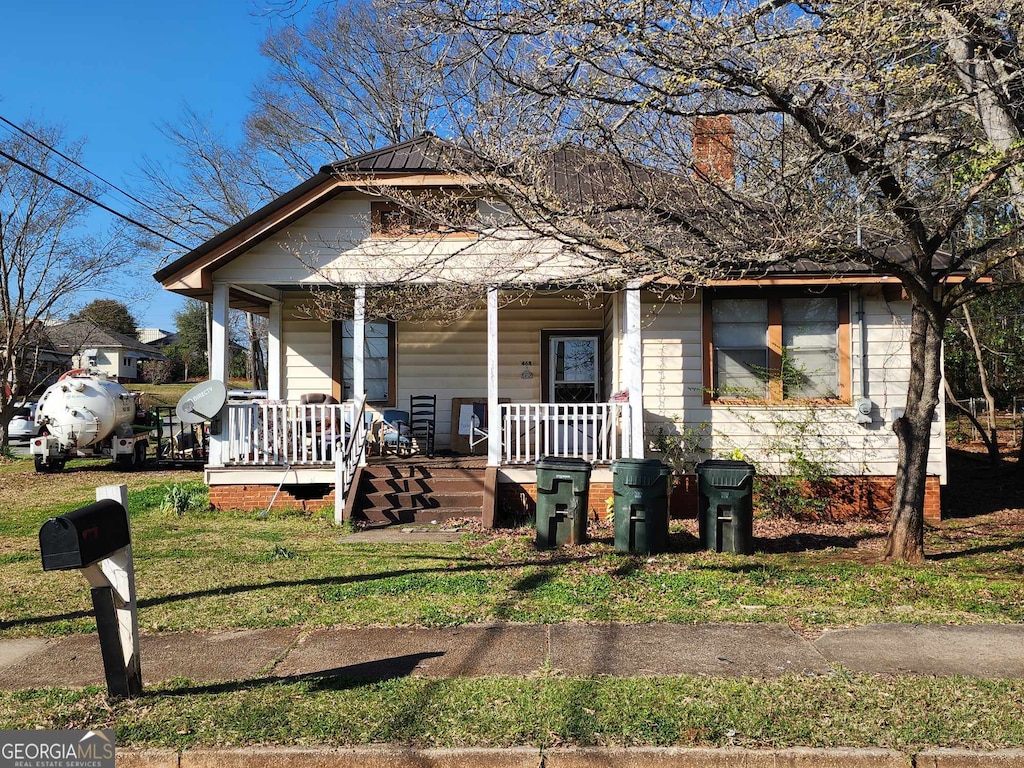 bungalow-style home with covered porch