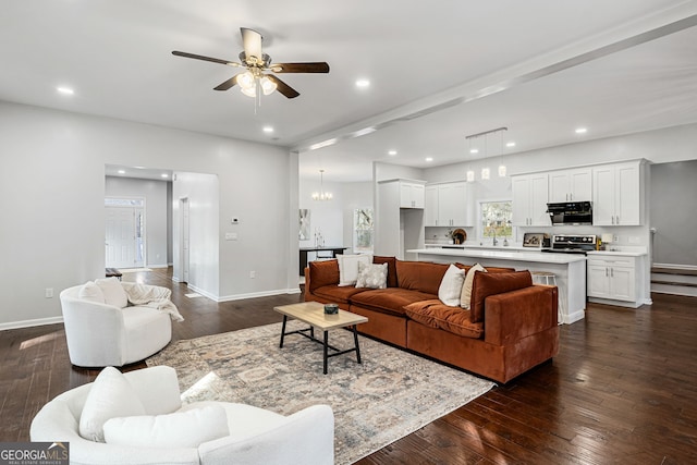 living room featuring recessed lighting, baseboards, and dark wood finished floors