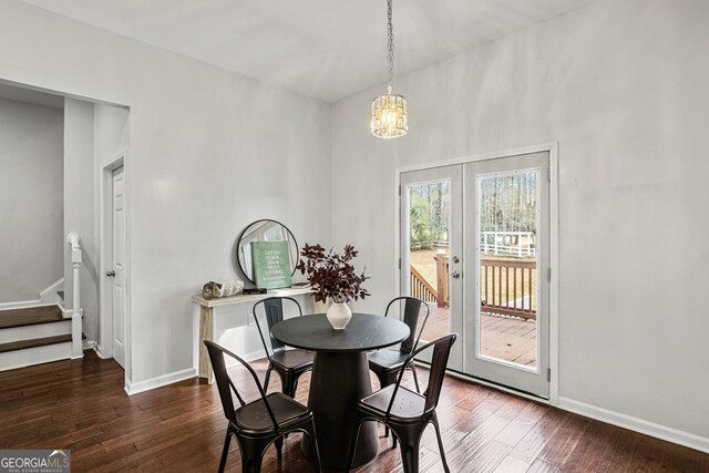 dining room featuring stairway, baseboards, a notable chandelier, and dark wood-style floors