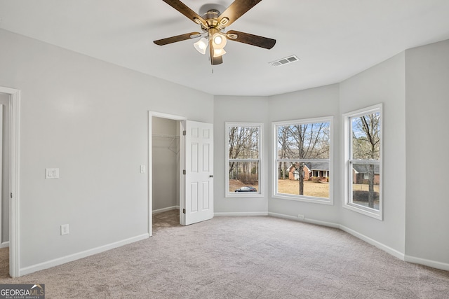 unfurnished bedroom with visible vents, baseboards, and carpet floors