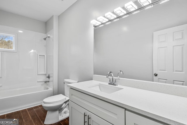 bathroom featuring toilet, vanity, shower / bathing tub combination, and wood finished floors