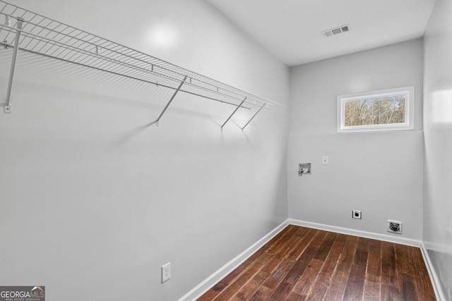 clothes washing area featuring visible vents, hookup for an electric dryer, dark wood finished floors, laundry area, and washer hookup