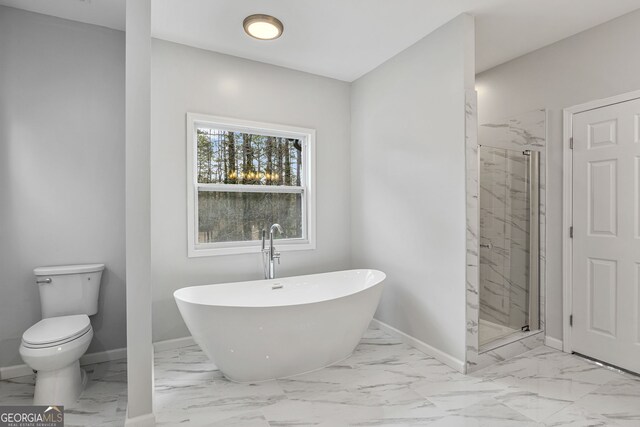 full bath with a marble finish shower, baseboards, a freestanding bath, and marble finish floor